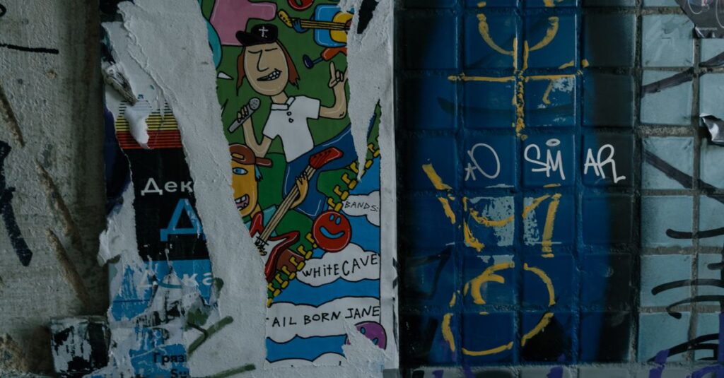 Vibrant street art poster on a graffiti-covered urban wall, depicting musical themes and abstract designs.