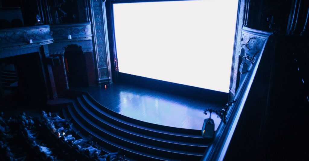 Explore the grandeur of Budapest's historic cinema, showcasing its rich architectural details and audience seating.