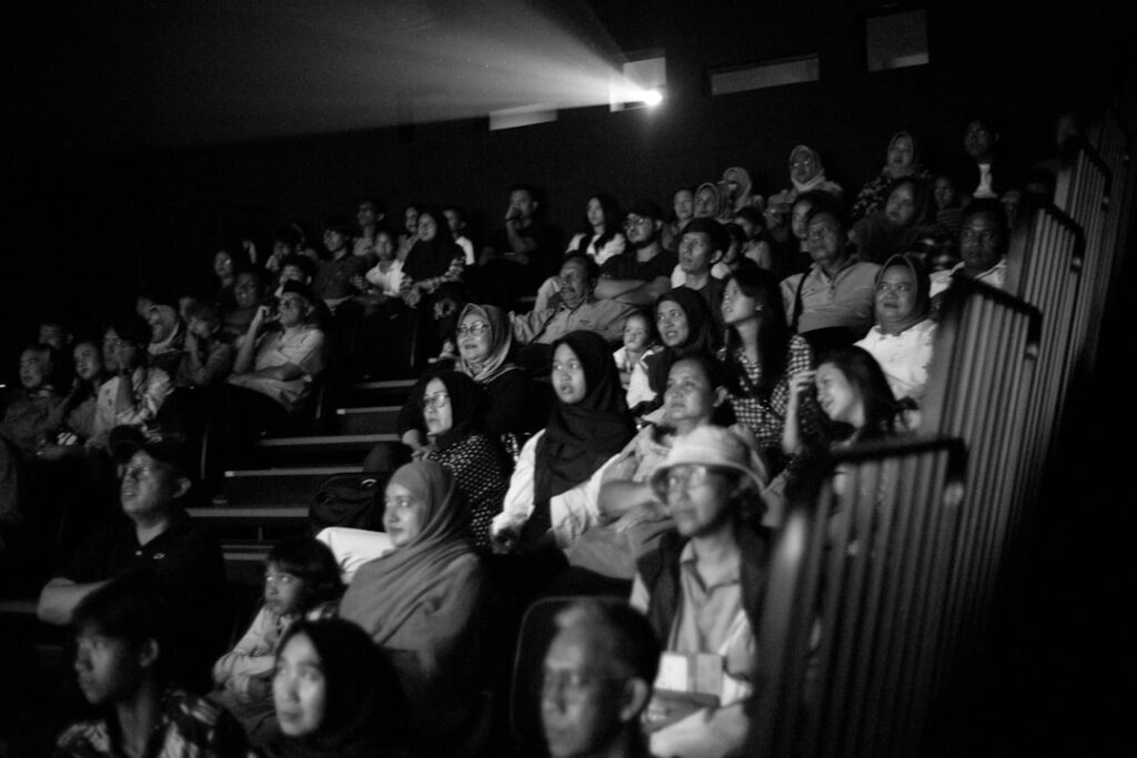 A black and white photo of a crowd of people