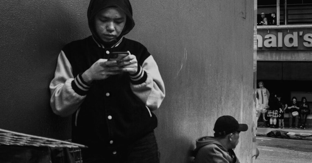 Candid black and white photo of daily life in Baguio City, featuring people in hoodies.