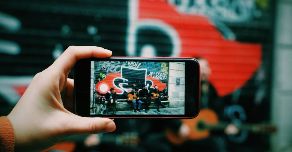 Street musicians playing guitar captured through a smartphone camera in an urban setting.