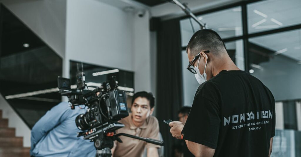 Camera crew working on a film set in Vietnam, capturing cinematic scenes indoors.