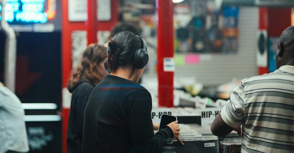 People exploring vinyl records in a bustling music store with vibrant atmosphere.