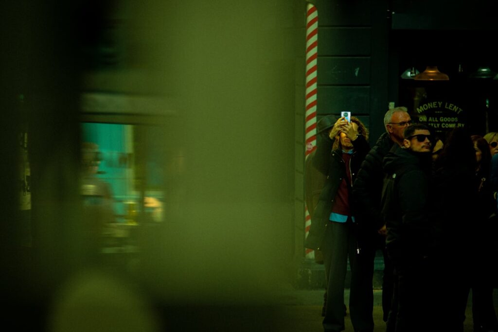People taking pictures on a city street