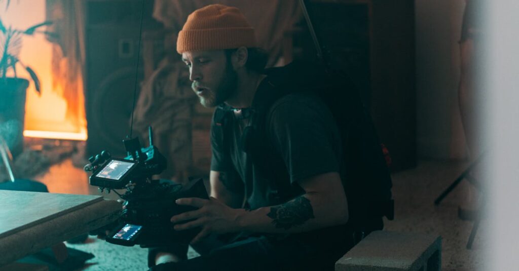 Professional cinematographer working indoors with camera gear, showcasing concentration and creativity during filming.
