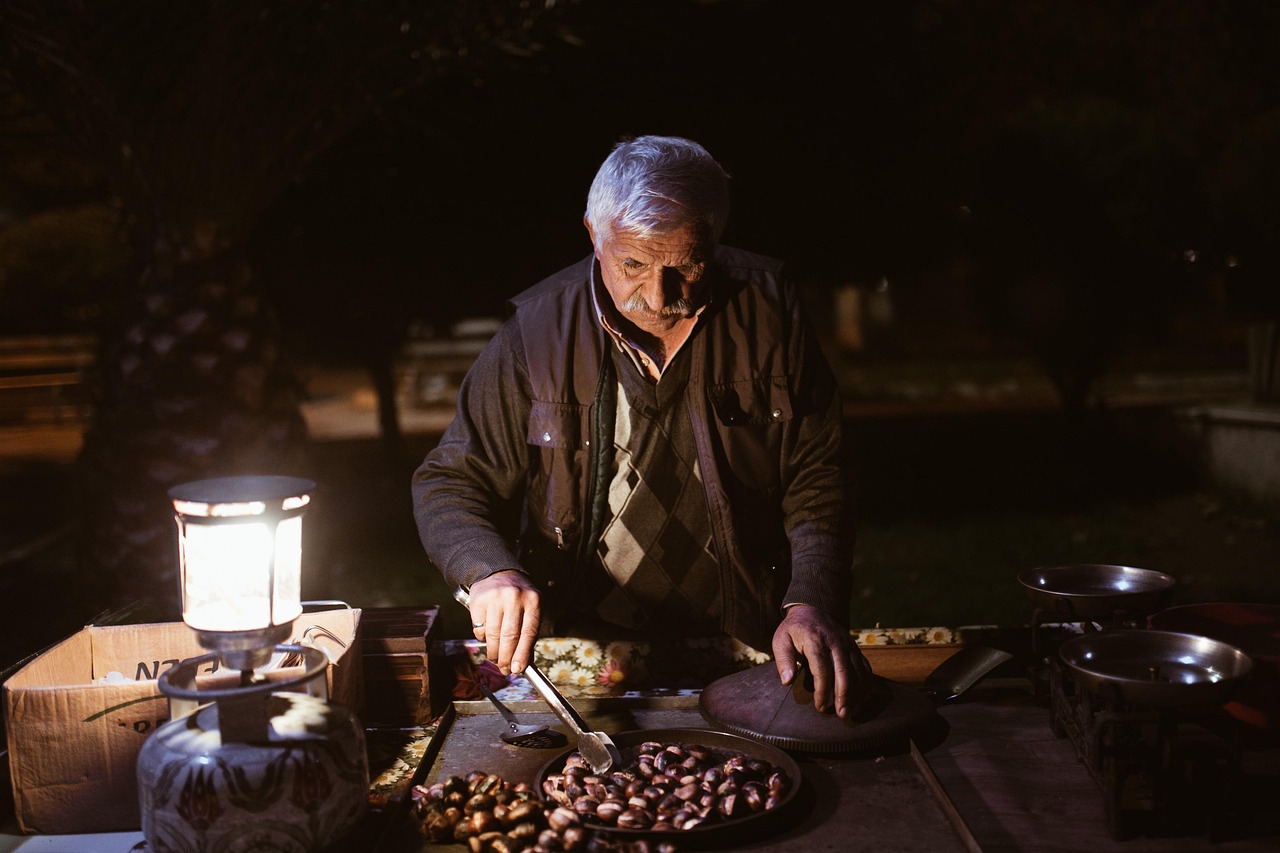 old man, night, chestnuts, peddler, street vendor, vendor, market, night market, elderly man, old man, old man, old man, old man, old man, market, market