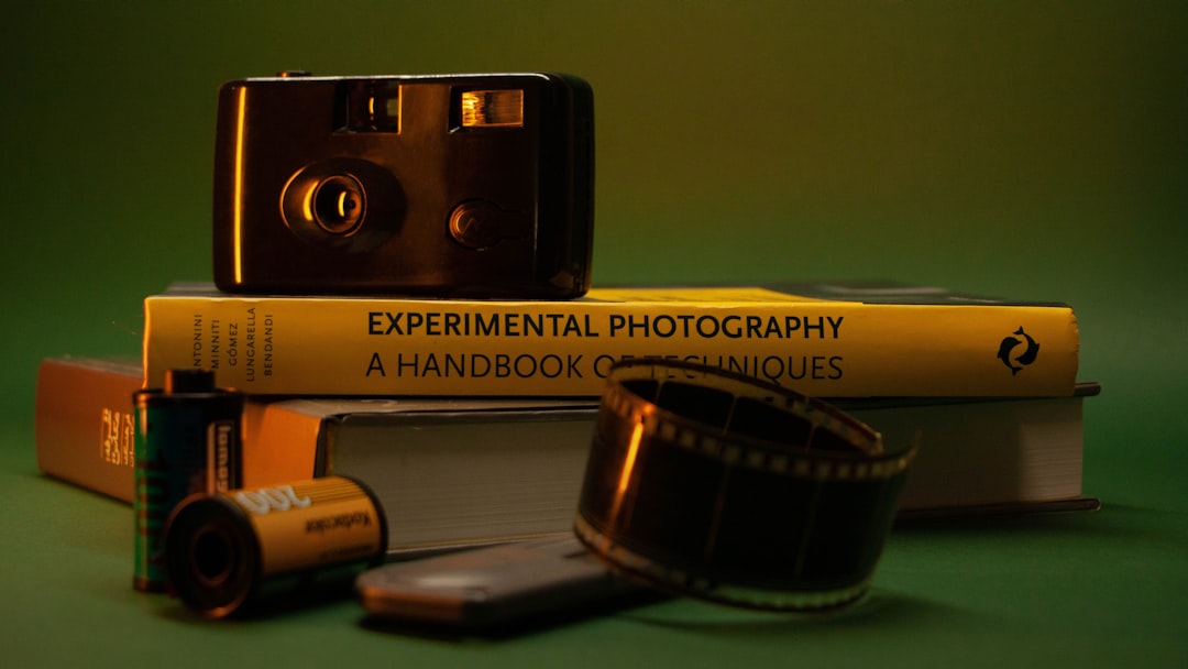 Film camera, books, and film spools.