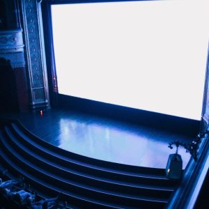 Explore the grandeur of Budapest's historic cinema, showcasing its rich architectural details and audience seating.