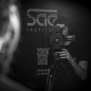 a man holding a camera in front of his face