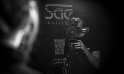 a man holding a camera in front of his face