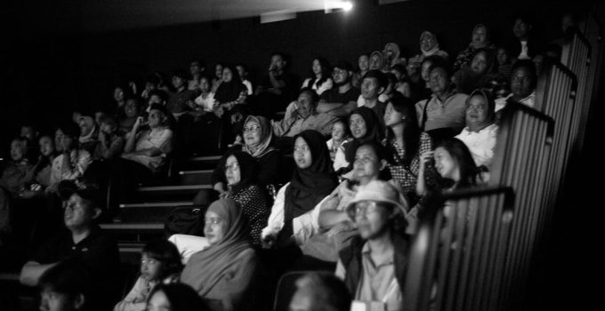 A black and white photo of a crowd of people