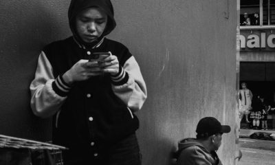Candid black and white photo of daily life in Baguio City, featuring people in hoodies.